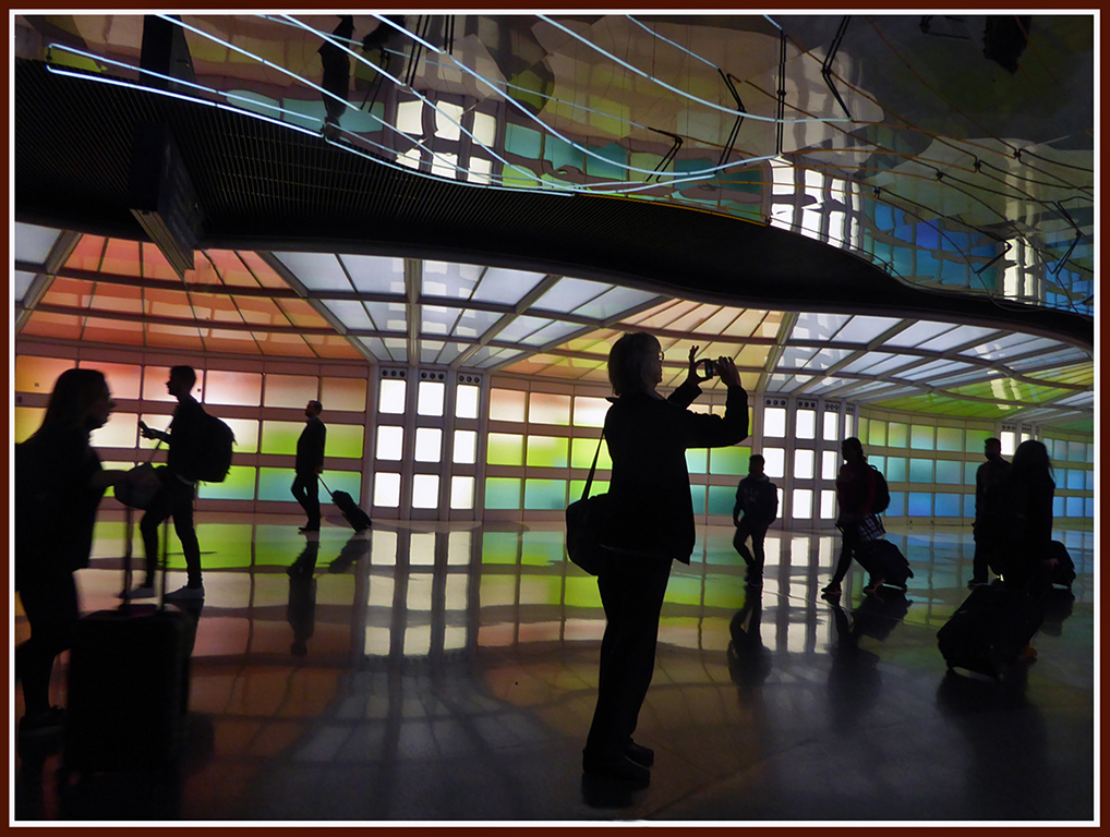 Silhouettes against colorful windows in a Chicago airport.... by Shirley Ward, FPSA, EPSA