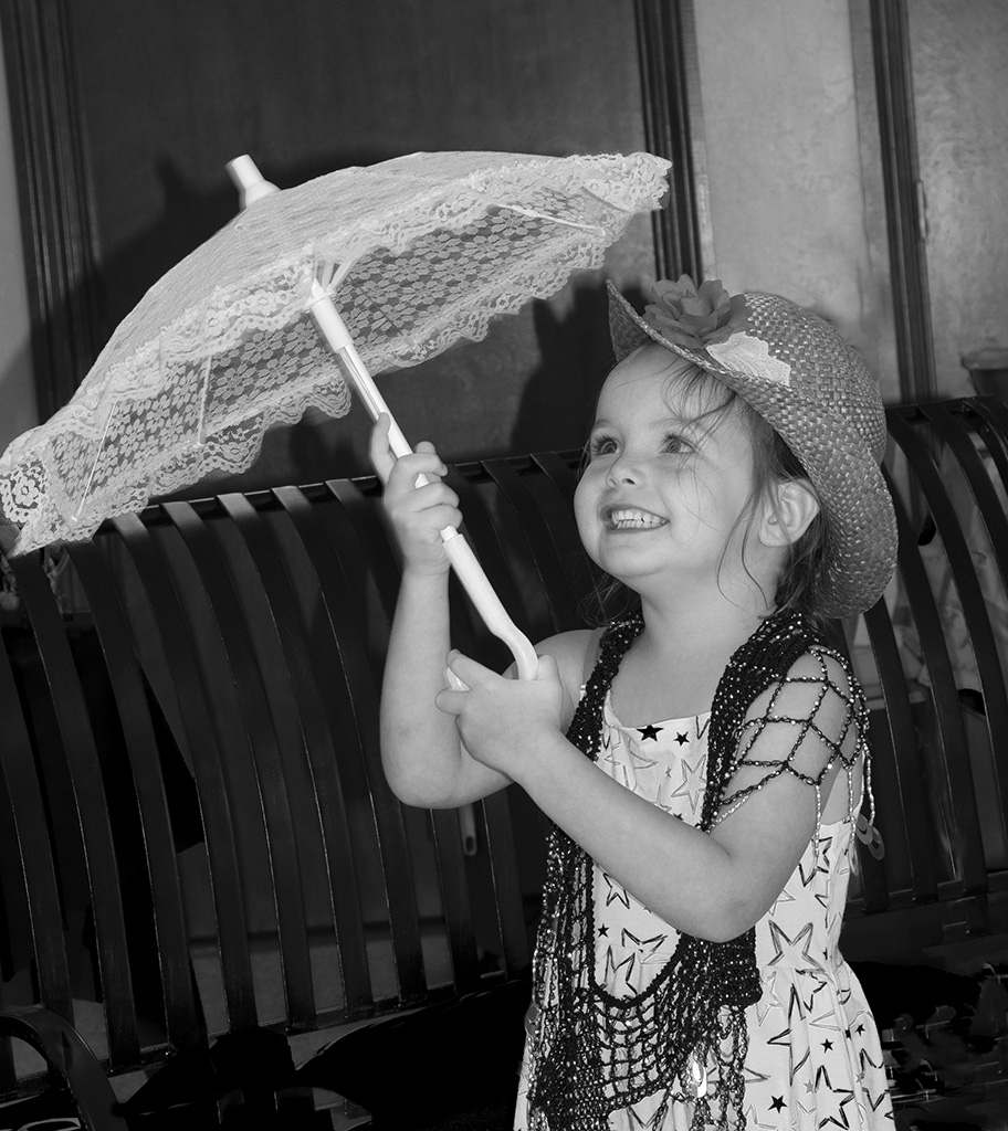 Umbrella girl by Tom McCreary, APSA, MPSA