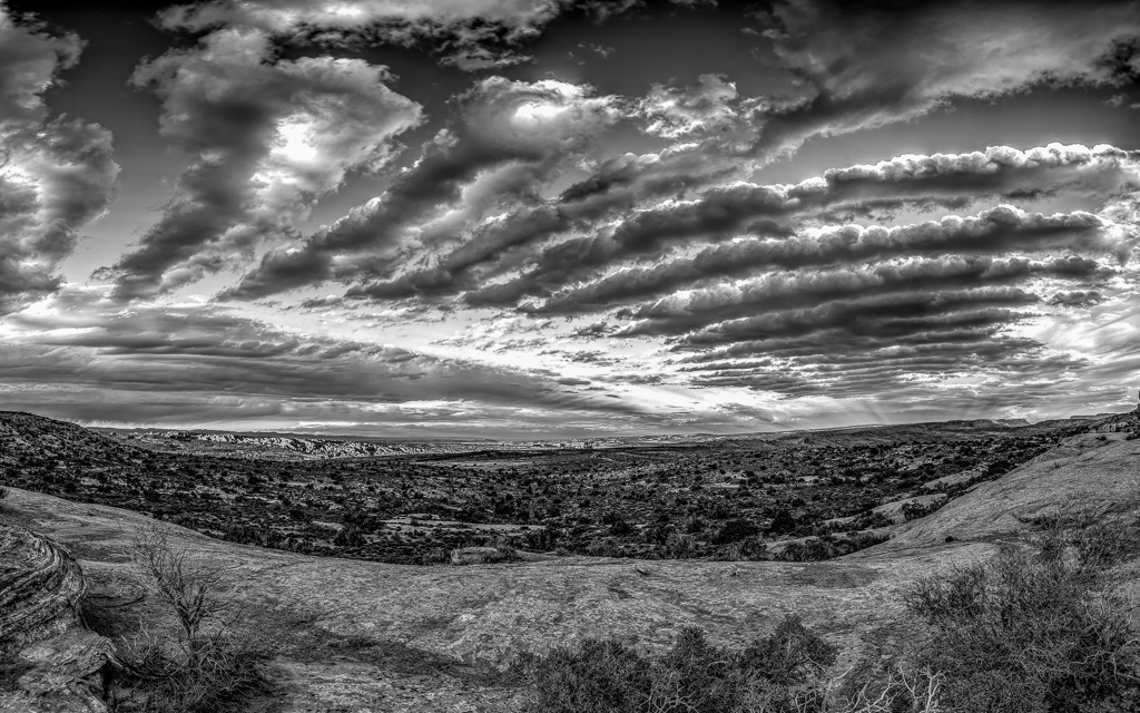 Clouds Over Arches NP by Michael Weatherford