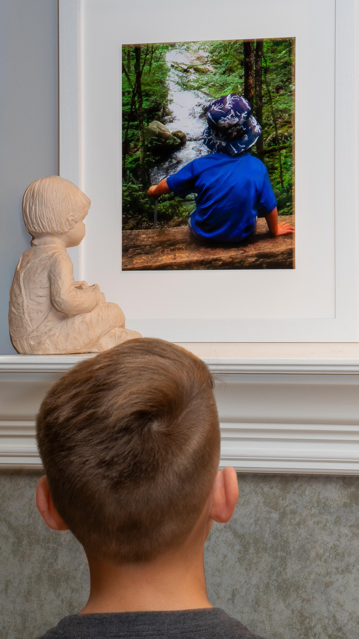 Evan viewing a younger version of himself by Jim Wulpi