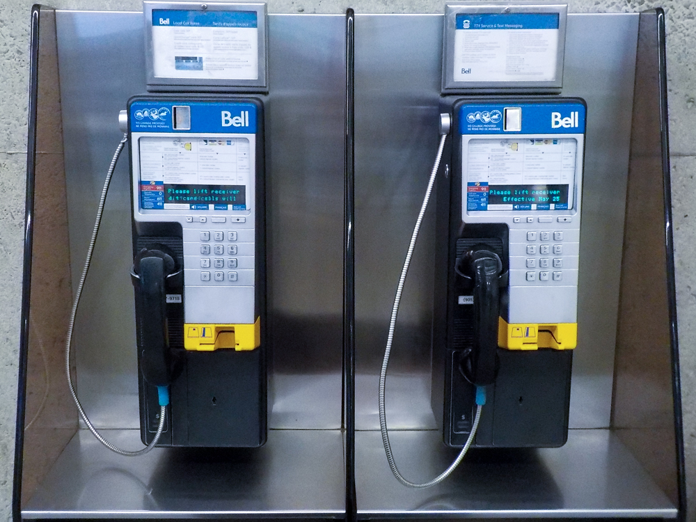 at THE HAMILTON PUBLIC LIBRARY TWO PAY PHONES by Timothy Morton