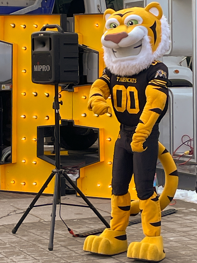 TC -- the HAMILTON TIGER CATS MASCOTT DANCING IN FRONT OF HAMILTON'S CITY HALL