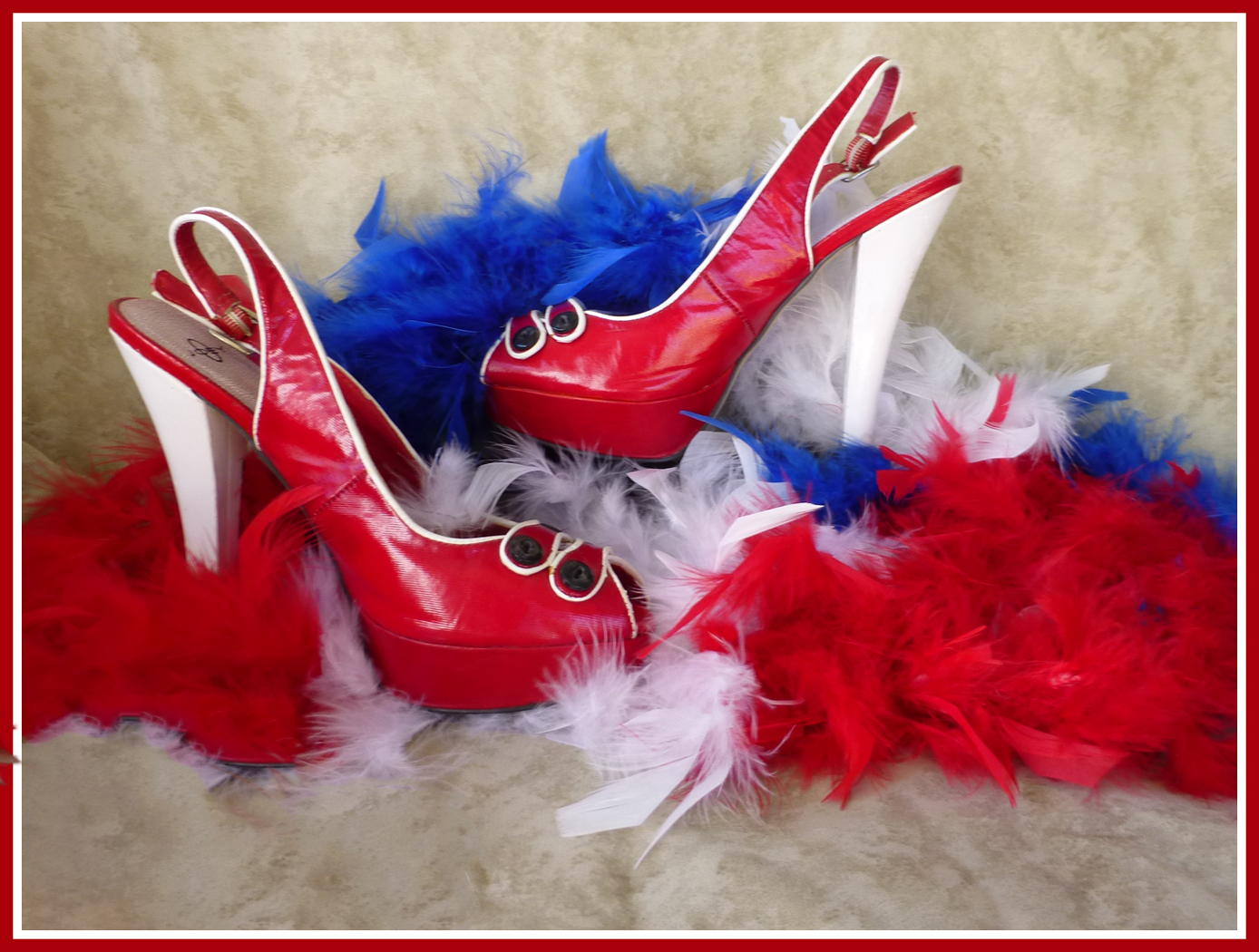 Red and White heels on red white and blue boa by Shirley Ward, FPSA, EPSA