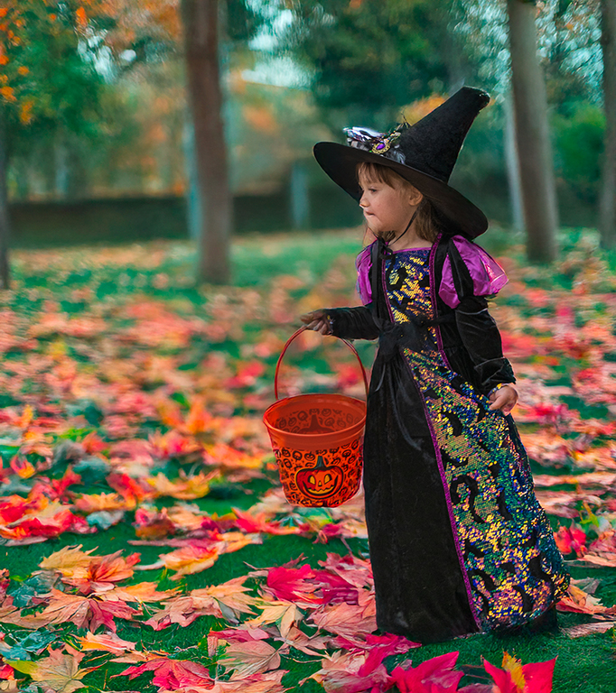 A little witch-dressed girl.  by Charlie Yang