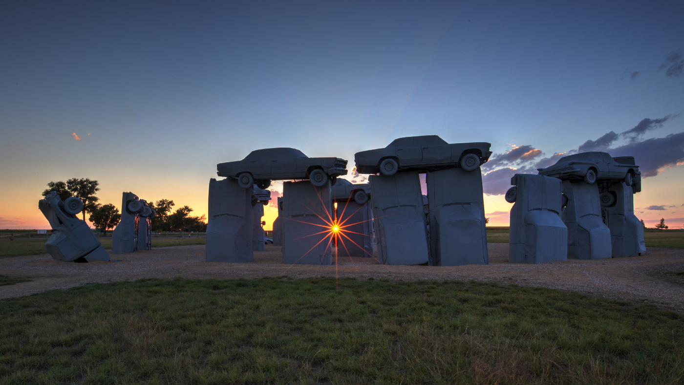 Sunrise at Carhenge in Alliance, Nebraska by Richard White