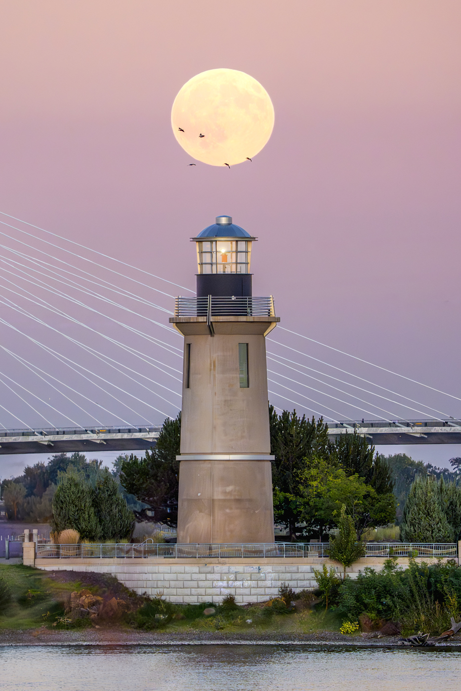 Harvest Moon over Lighthouse by Morrie Carter