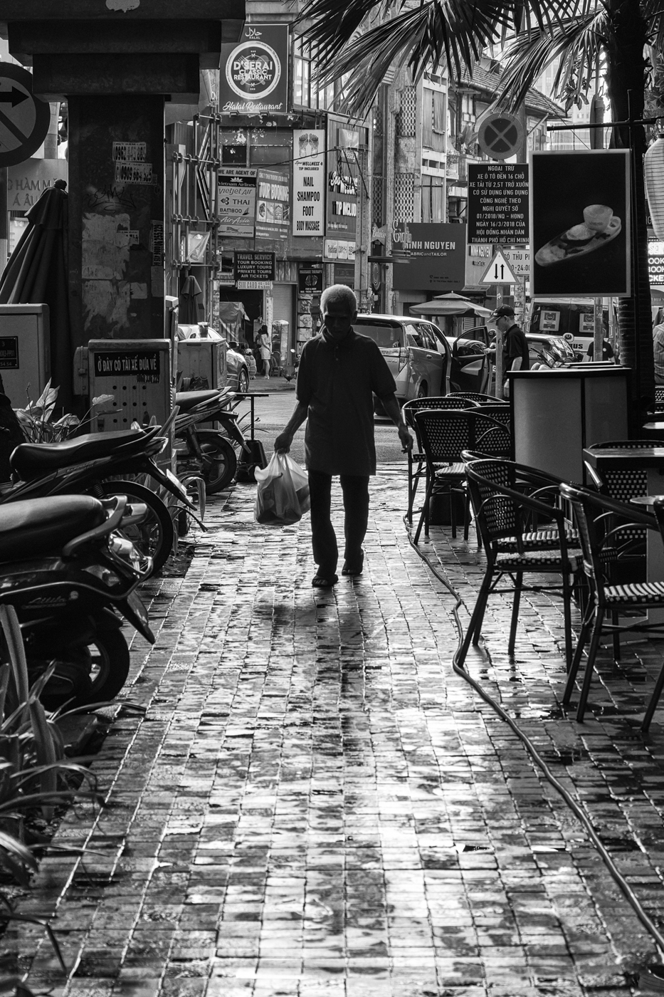 Sidewalk of Ho Chi Minh by Morrie Carter