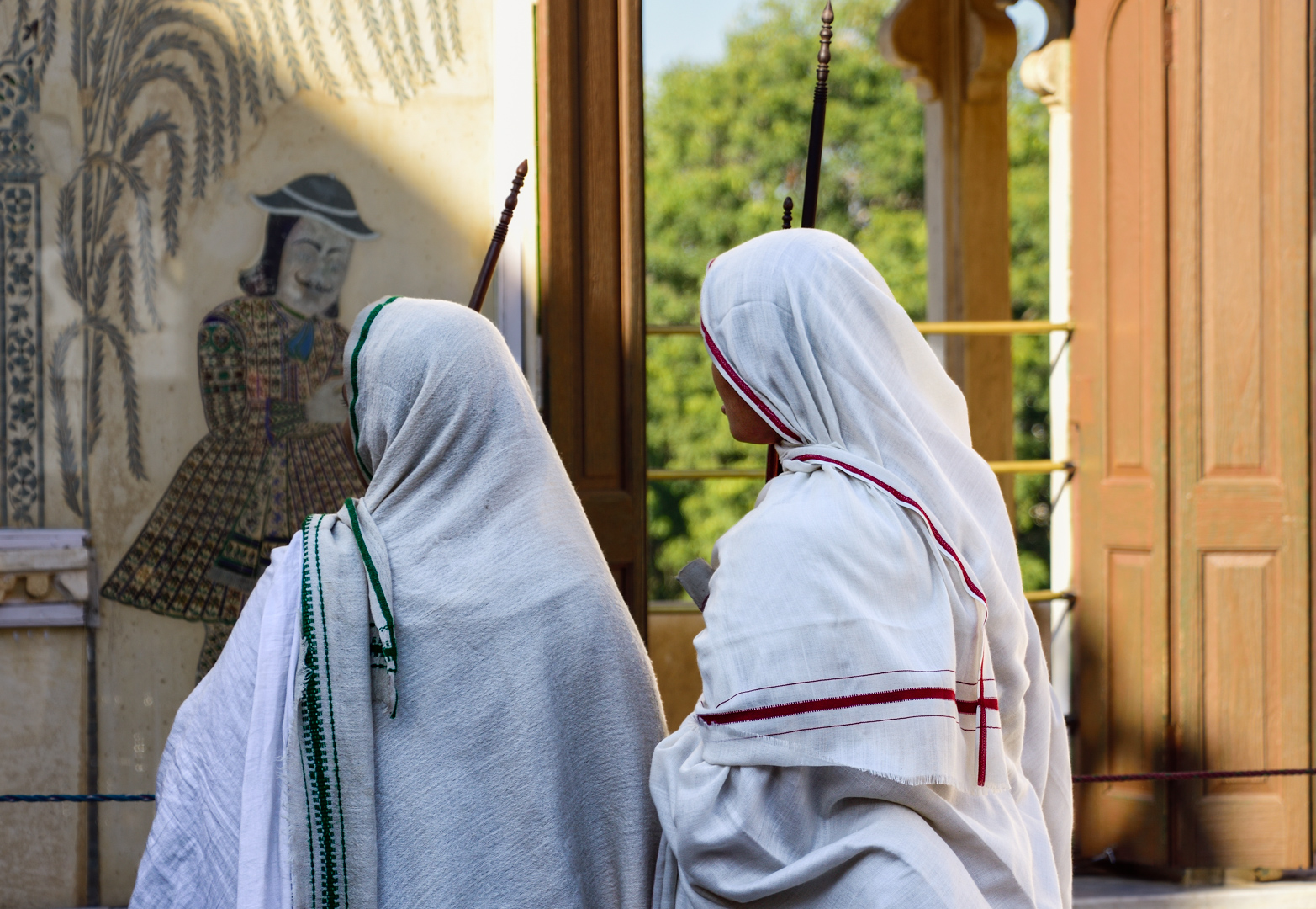 Young Jain Nuns watching Wall Art  by Pinaki Sarkar