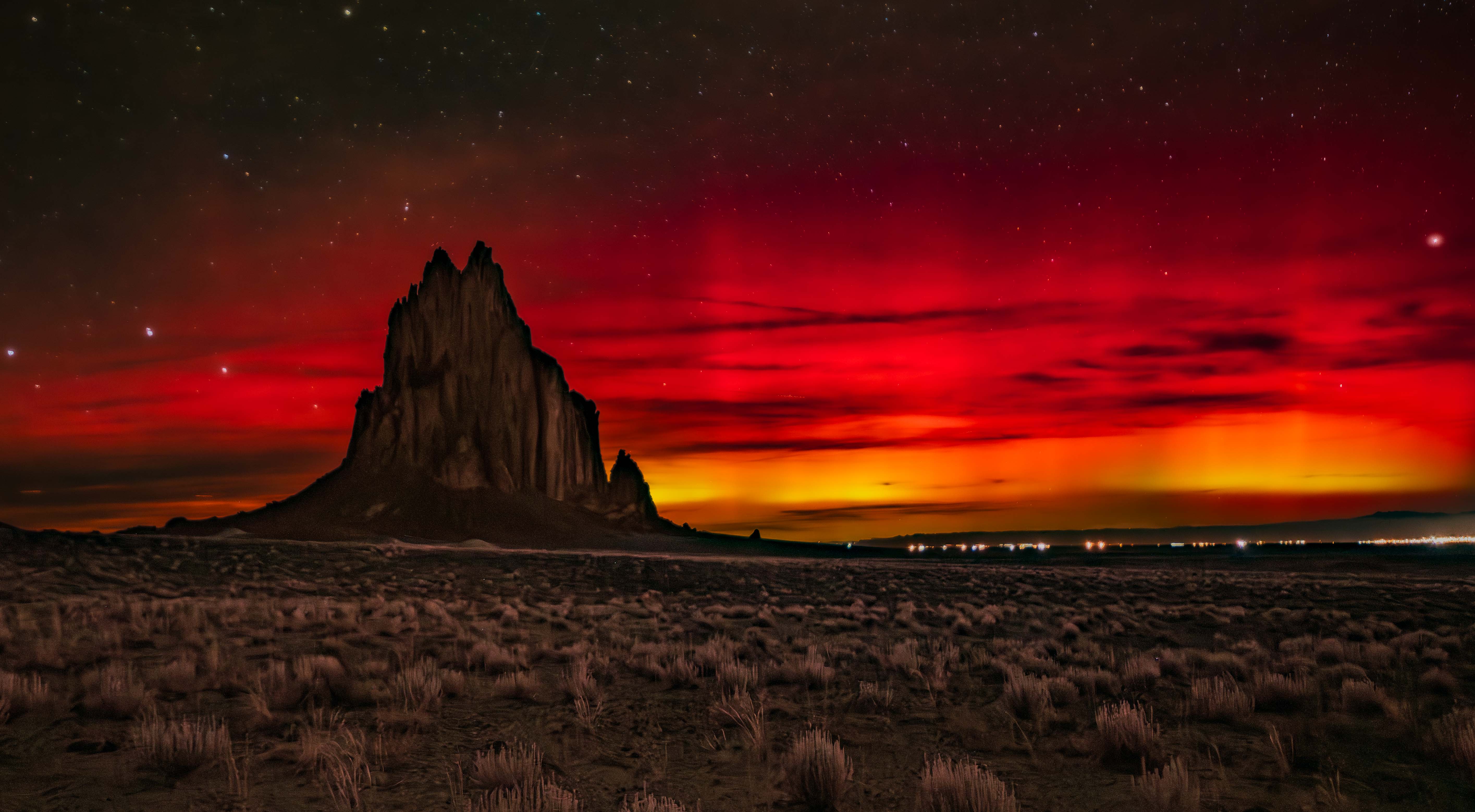 Shiprock with Aurora by Raymond Tice