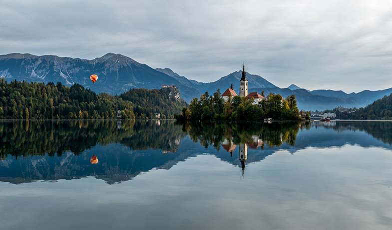 Slovenia Church and balloon view by Randall Gusdorf