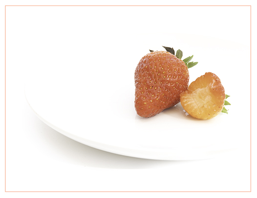 Strawberries on a plate by Angela Bonner