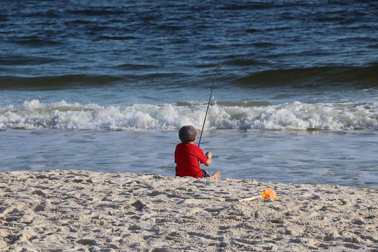 Orange Beach Boy Fishing by Keith Francis