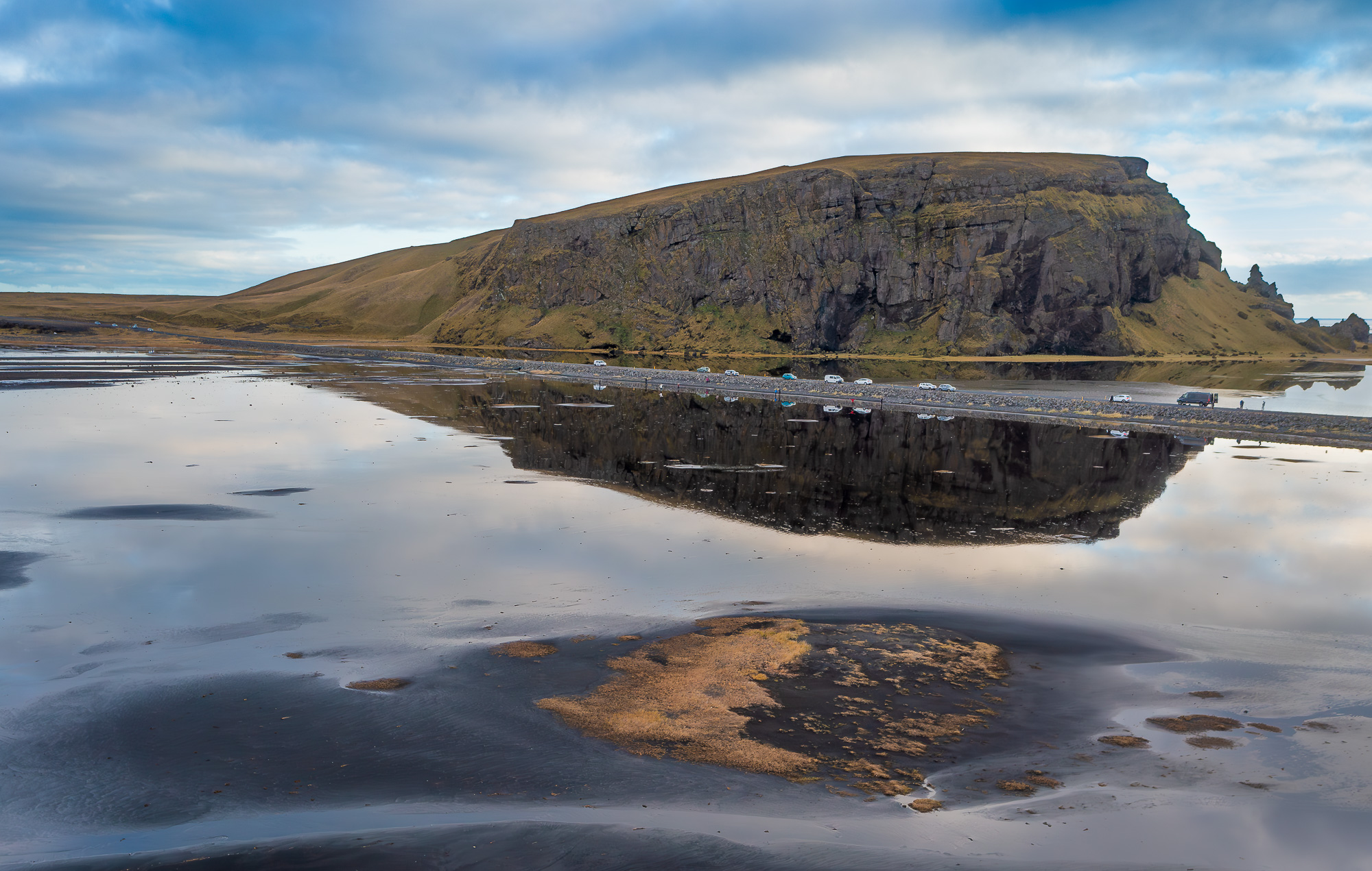 Reflections of Dyrholaey Iceland by Lou McLove